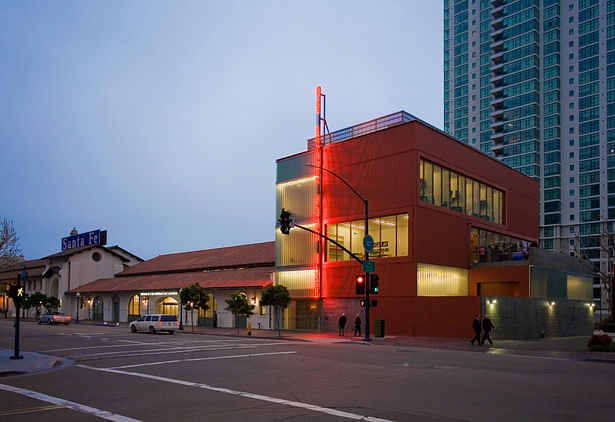 The contemporary addition is clad in red corrugated metal decking, an homage to the clay-tile roof of the existing station and baggage buildings. Channel glass, and alternating bands of windows provide daylight for the museum offices, boardroom, and multipurpose room contained in the addition. PC:David Heald