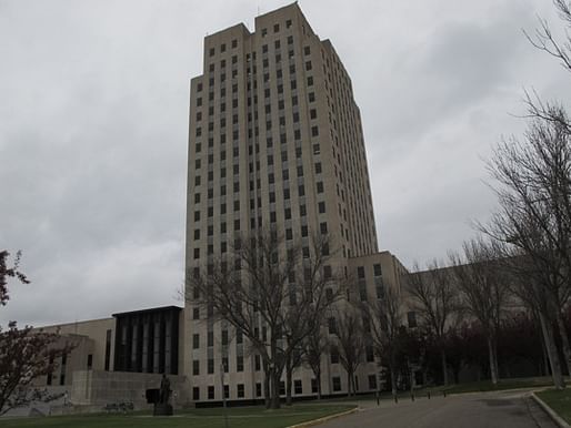 (Dale Wetzel/ Associated Press ) - This photo, taken Thursday, April 19, 2012, shows the North Dakota Capitol, whose main tower is almost 250 feet high. The Republican majority leader of the Minnesota House on Thursday described the North Dakota Capitol building, which is located in Bismarck...