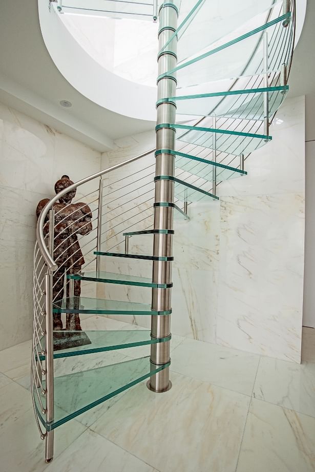 Spiral Staircase Featuring Stainless Steel Railings with Glass Treads & Landing.