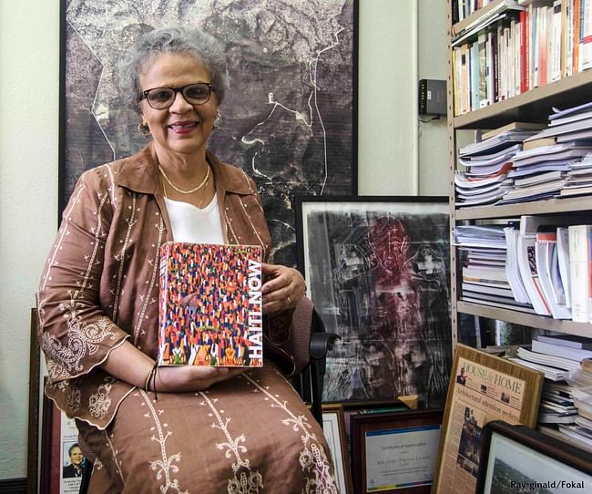 Former Haitian Prime Minister Michèle Pierre-Louis with her copy of Haiti Now. Photo via thenowinstitute.org.