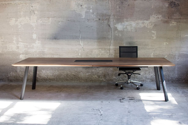 Conference table in walnut and steel legs fabricated by Synecdoche