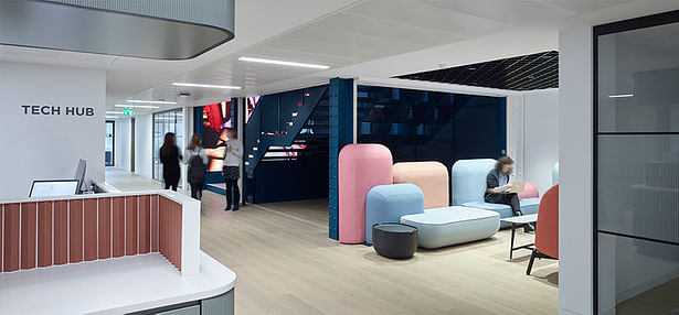 Modular seating in pastels adds playfulness in breakout areas