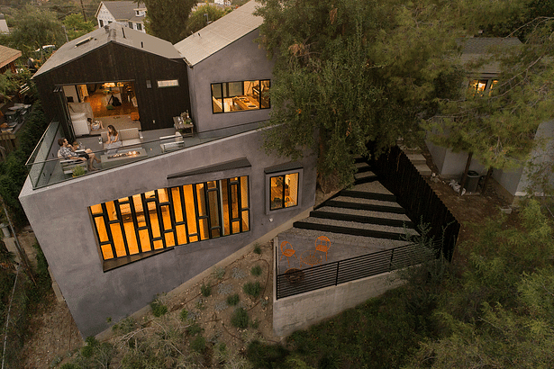 The relationship of the house to the canyon is revealed dramatically at dusk.