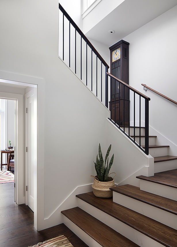The light-filled staircase creates an effortless central axis to the home.