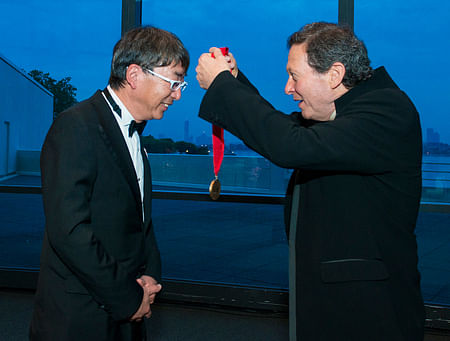 Toyo Ito, 2013 Laureate, is awarded the Pritzker's bronze medal by Thomas J. Pritzker. © Rick Friedman