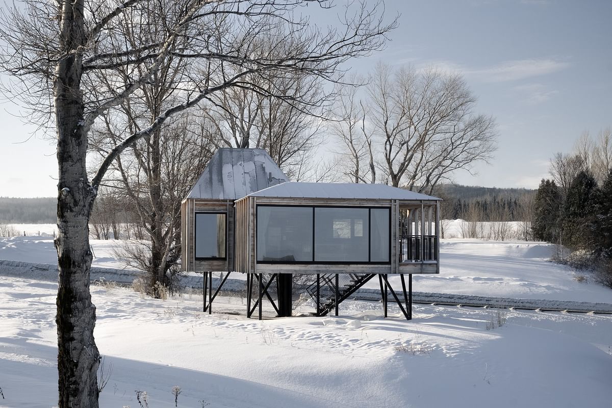 Delordinaire Architects designs a lakeside modular stilt house in Quebec