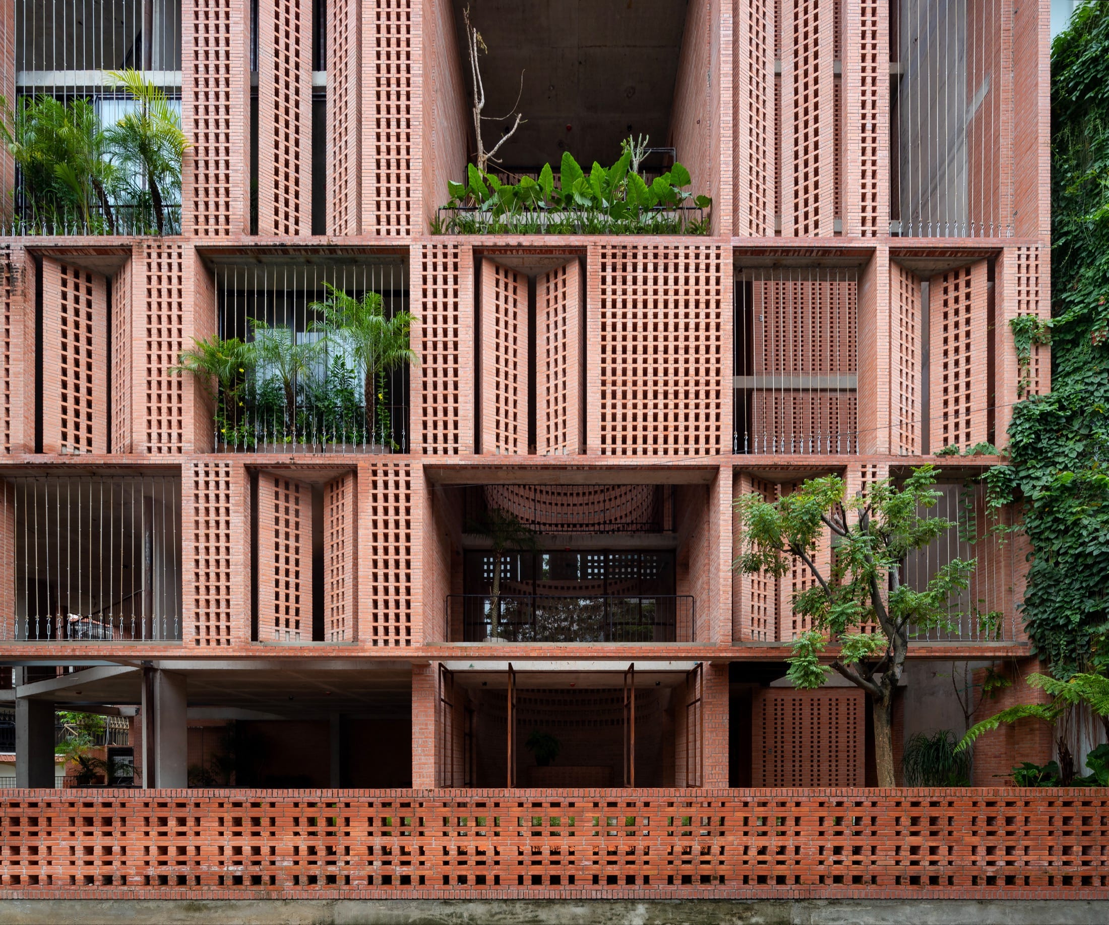 A perforated brick facade wraps Tropical Space’s new Ho Chi Minh City ...