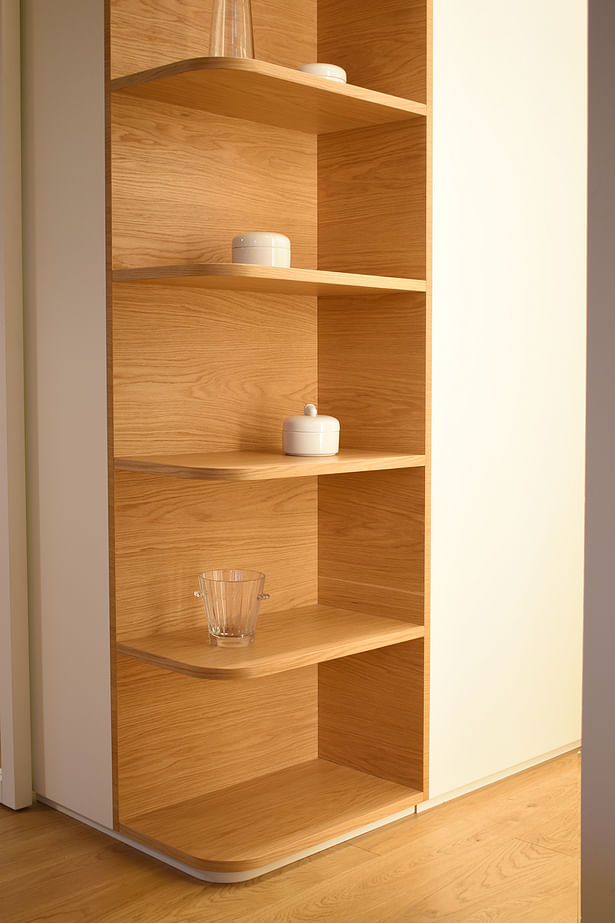 detail of angle bookshelf bespoke bookshelf, with curved shelves at the angles