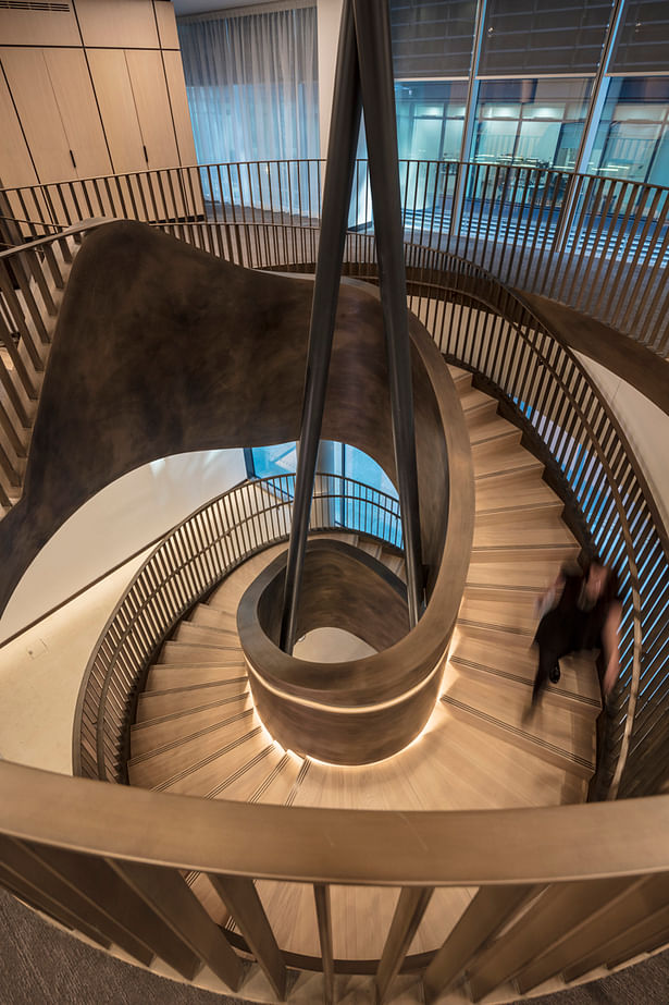Designed by MCM and manufactured by EeStairs, the stairs forms the heart of the building