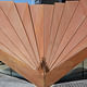 Corten panels form a monocoque structure which meets the ground at just three points and provides channels for the rainwater.