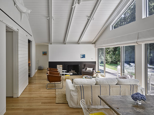 French doors and large picture windows fill the room with light.