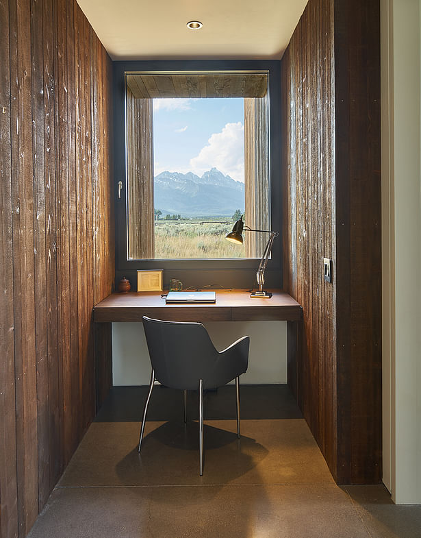 Custom built-in office desk are fabricated from a mixture of walnut, mimicking the same hue as the façade’s Douglas fir. 