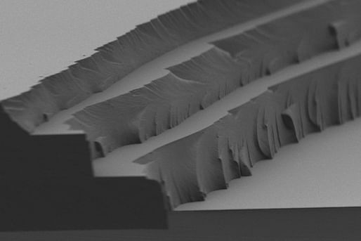 Microscopic view of the new MIT-developed solar thermal fuel polymer film and its three distinct layers—each 4 to 5 microns thick. (Image: MIT)