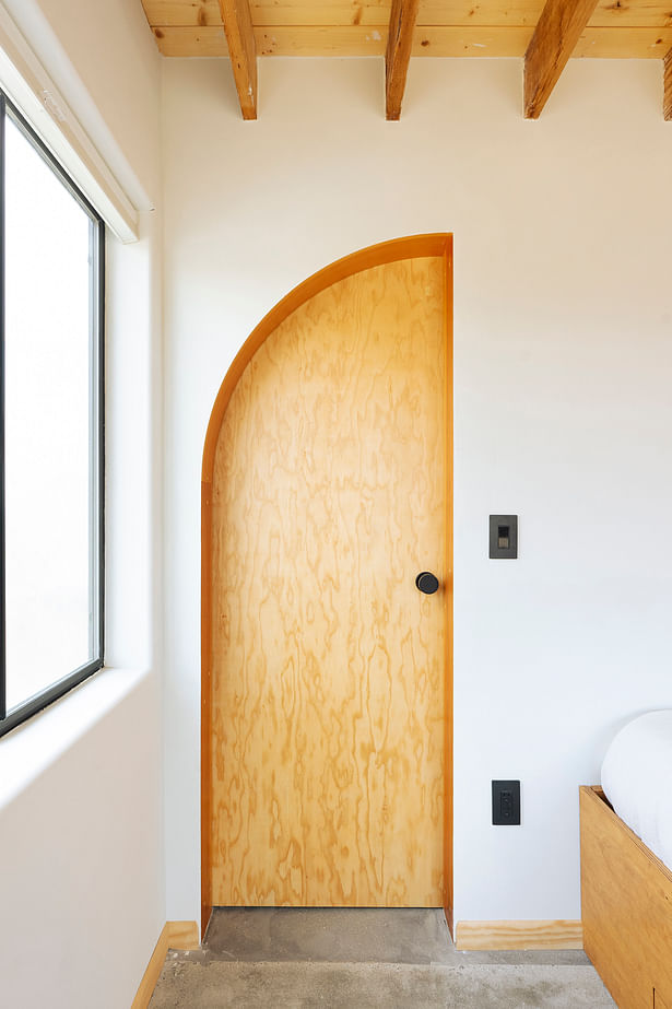 View of half-arched bathroom door