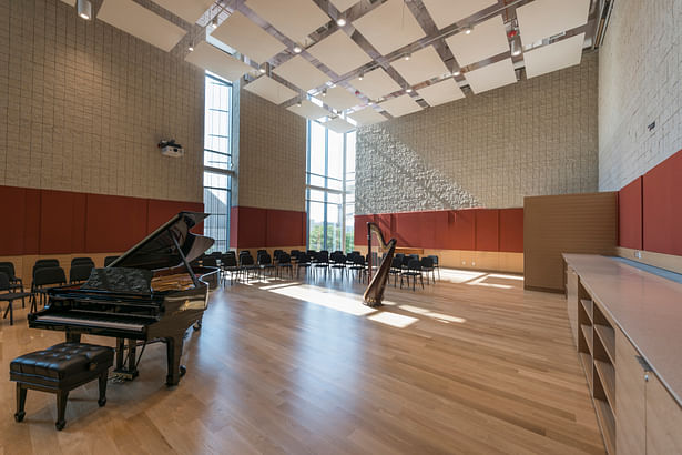 The 3,000-square-foot orchestral rehearsal room is acoustically isolated and has adjustable acoustical controls to support a variety of configurations. With its hardwood floors, the room is the ideal space for string instruments. Photo credit: Peter Vanderwarker