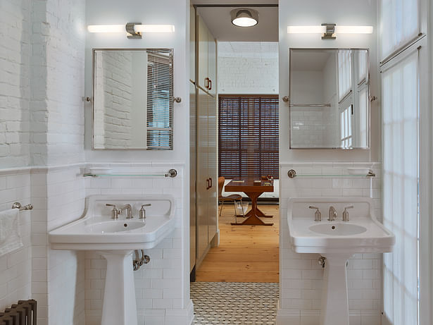 The loft features 1.5 bathrooms. Classic fixtures complement the historic material palate.