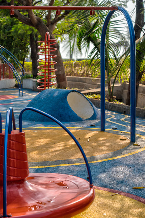 Soft, cushioned flooring in the play area protects children from injuries.