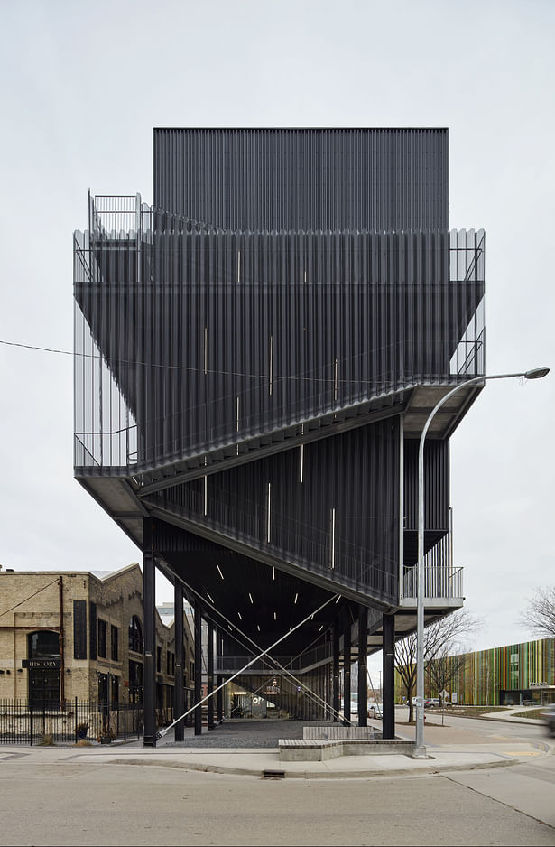 Lifting the residential structure created a public plaza underneath while also maintaining visibility of the historic Pumping Station from Waterfront Drive.