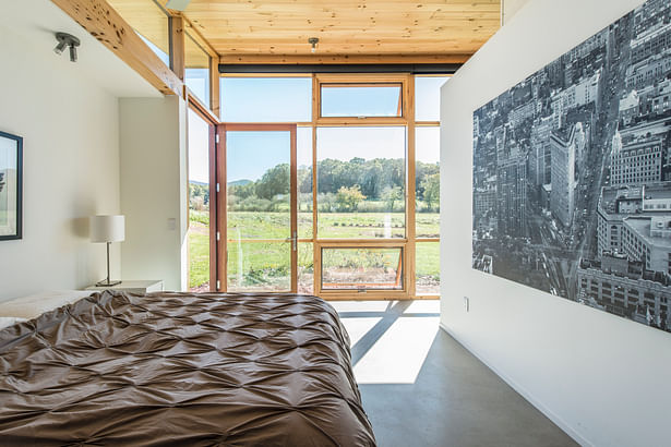 The master suite views are to the site's future agricultural fields and the national park beyond. A door to the left is to a small sunning patio. photo: Fredrik BrauerMaster bath photo: Fredrik Brauer