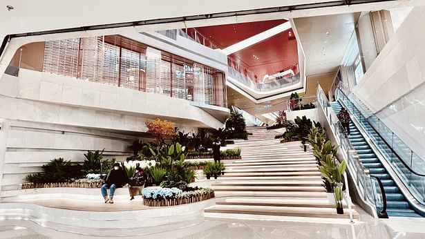 Grand stairs ascend to the atrium