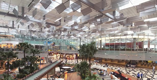 Changi Airport Terminal 3’s sky-lit main roof stretches from the kerbside to the airside and features expanses of planting that rise through different levels.