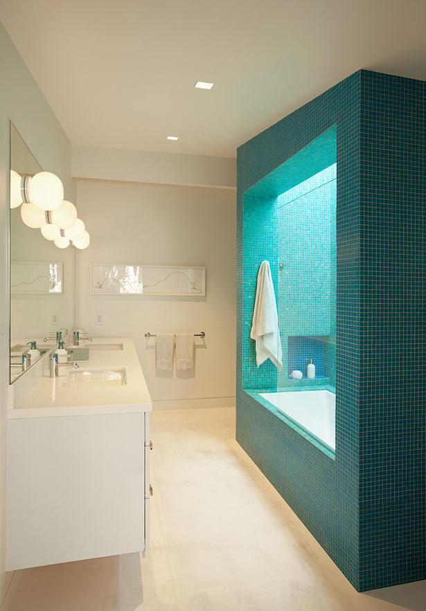  The children’s bathroom had no direct window to the outside. So the shower/bath was conceived as a massive inhabitable lightwell, with two colors of mosaic glass tile for the outside and inside. It was designed with the client’s eight year old daughter, and the metaphor of a geode was embraced.