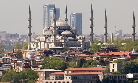 Coming down … The OnaltiDokuz towers in Istanbul, shown here looming above the Blue Mosque, now face demolition after a court order. (The Guardian; Photograph: Avrupa)