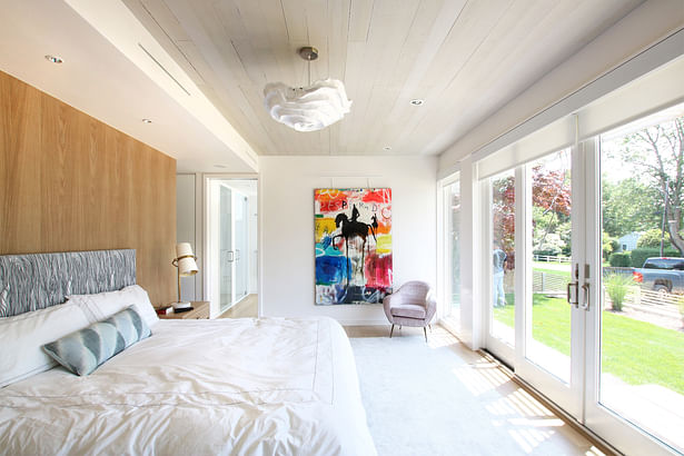 The Master Bedroom Opens to the Exterior with Sliding Glass Doors