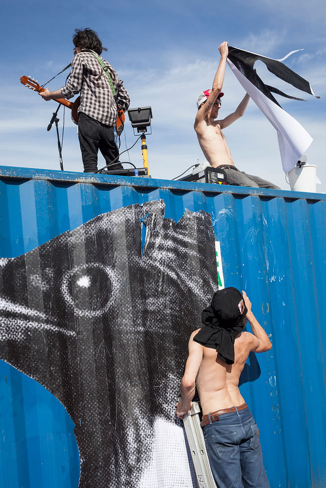 Musicians play on top of the containers (photo by Dylan Perrenoud)