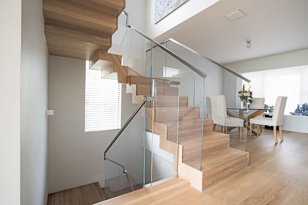 View of floating staircase from the second floor.