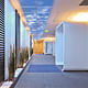 Hallways in corporate towers benefit from altering the perceived zenith.