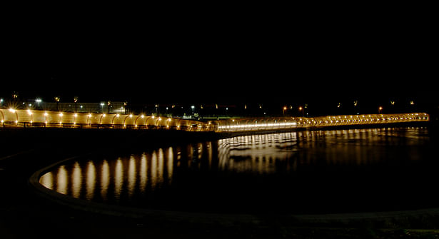 View at night across the upper lake of the west elevation of the armature