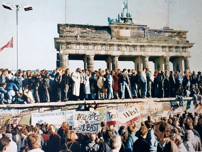 Exuberant Berliners on top of the Wall before it was demolished. Credit: HistoryToday