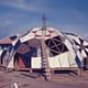 Film still from Joan Grossman's 2012 documentary 'Drop City' where three students from University of Kansas in Lawrence built recycled, low-cost geodesic domes. Buckminster Fuller awarded the designers his Dymaxion Award in 1966. Image from affr.nl. 