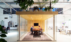 A garden is the roof of a meeting room in a loft office by jvantspijker