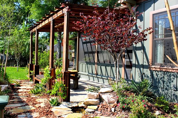 Reclaimed yellow pine joists and beams make this pergola