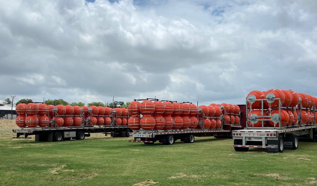 The DOJ says it will sue Texas over floating Rio Grande migrant ...