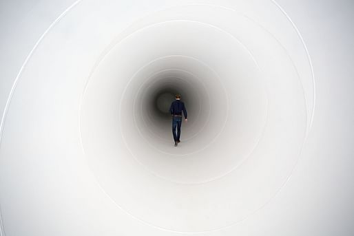 A member of the Hyperloop team at Delft University of Technology, in the Netherlands, walks down a tunnel.Photograph by Arie Kievit / Hollandse Hoogte / Redux