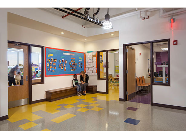 Classrooms are clustered by grade and designated by color. Shared break-out nooks for each grade cluster provide a 'front' porch along the corridor.