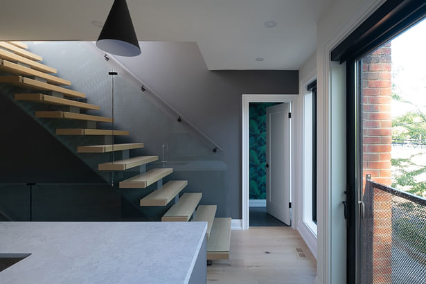 home A: custom staircase between second-floor and rooftop