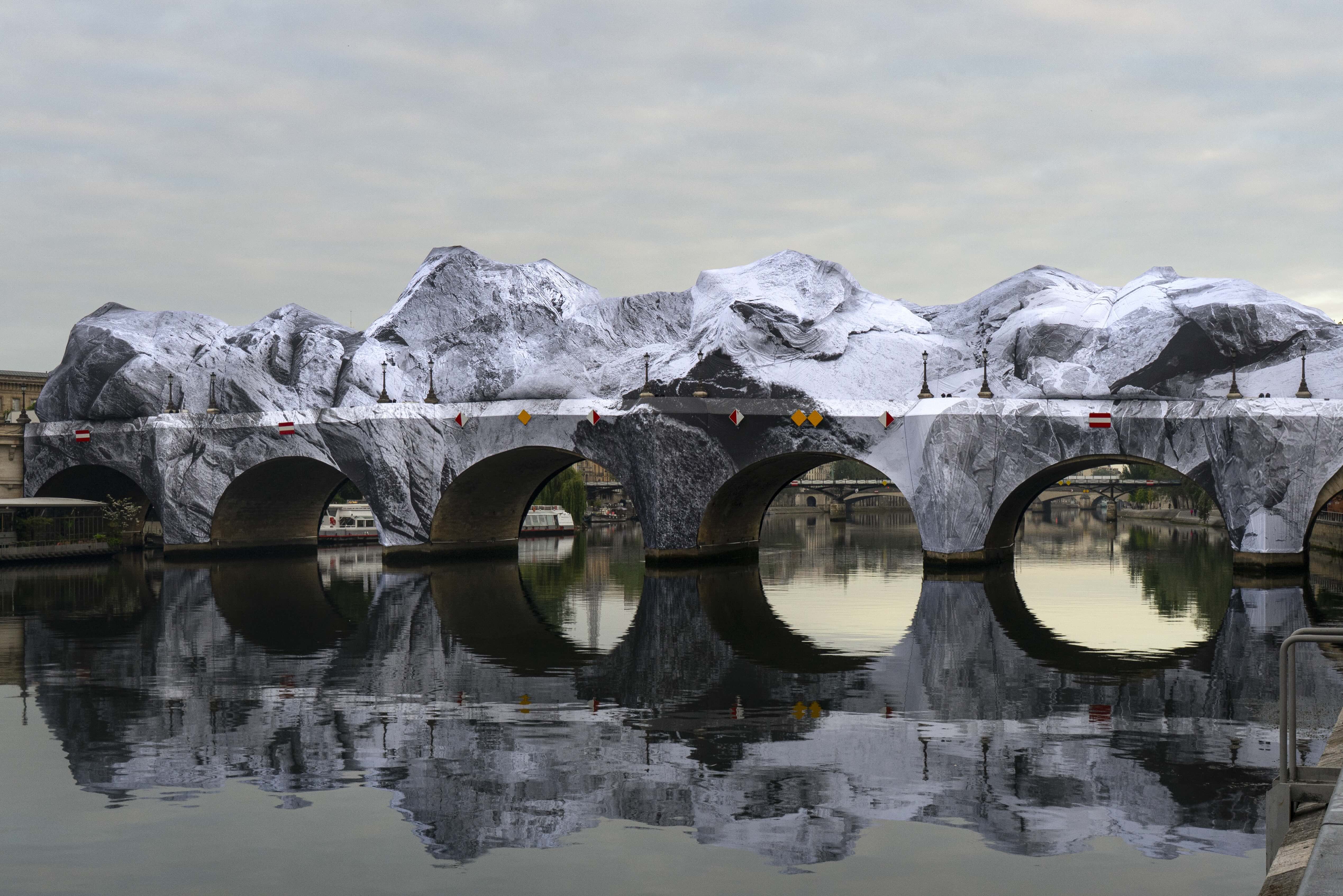 JR wraps Paris' Pont Neuf in inflatable fabric skin in tribute to