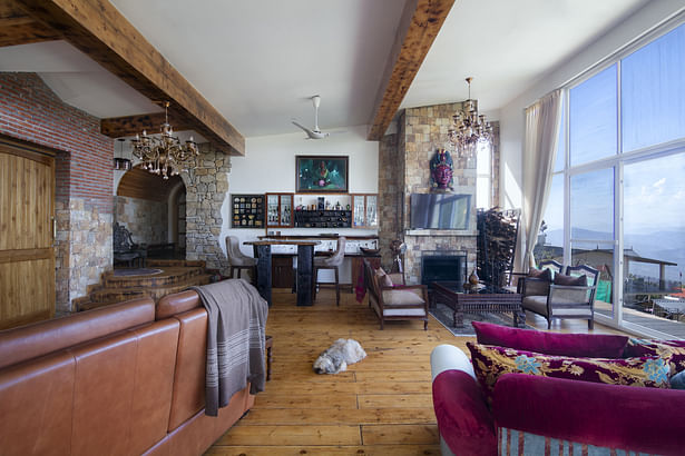 Looking over from day beds towards the living area and bar. On the left is study with recliner.