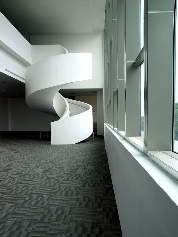 An internal feature that can be seen from the main road, the spiral staircase connects the showroom to the office and meeting spaces above