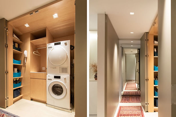 Similarly, a laundry closet has double millwork doors that read as full height, floor-to-ceiling panels when closed. When open, though a room, the interior reads as another cabinet with pre-finished maple built-ins, including the one special request from the owners a pull-out ironing board drawer.