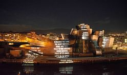 Gehry's Guggenheim Bilbao lights up covered in Jenny Holzer projections this week