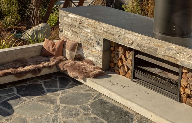 Ben Hudson Architects - Gallery House - stone clad outdoor sunken fire area