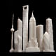 'Flammable' by architect Jingjing Naihan Li scales down the world's most celebrated skyscrapers into wax candles. Image via naihanli.com