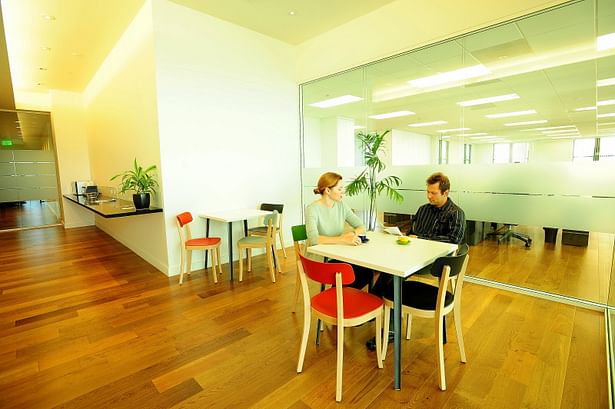 Furniture provided by the Owner provides fun color against the white background.