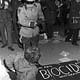 A policeman telling Earth Day protesters to leave the premises at Logan Airport. In protest against the airport’s air pollution, its expansion, and the arrival of supersonic jets, demonstrators staged a mock funeral in the lobby, with coffins. Project: Earth Day; Boston, MA, USA, 22 April 1970. Photo: Spencer Grant
