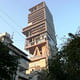 Skyscraper for one: billionaire Mukesh Ambani's 27-storey home 'Antilia' towers over adjacent apartment buildings in Altamount Road, South Mumbai. Photo: Kerwin Datu